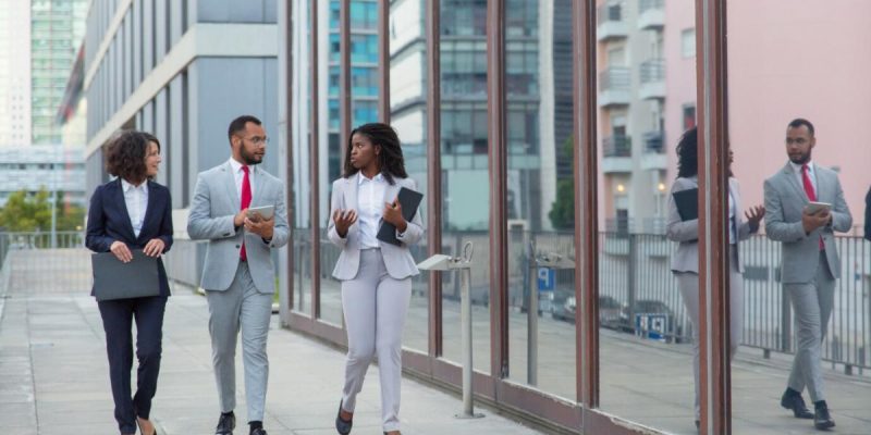 professional-multiethnic-business-team-street_74855-1197